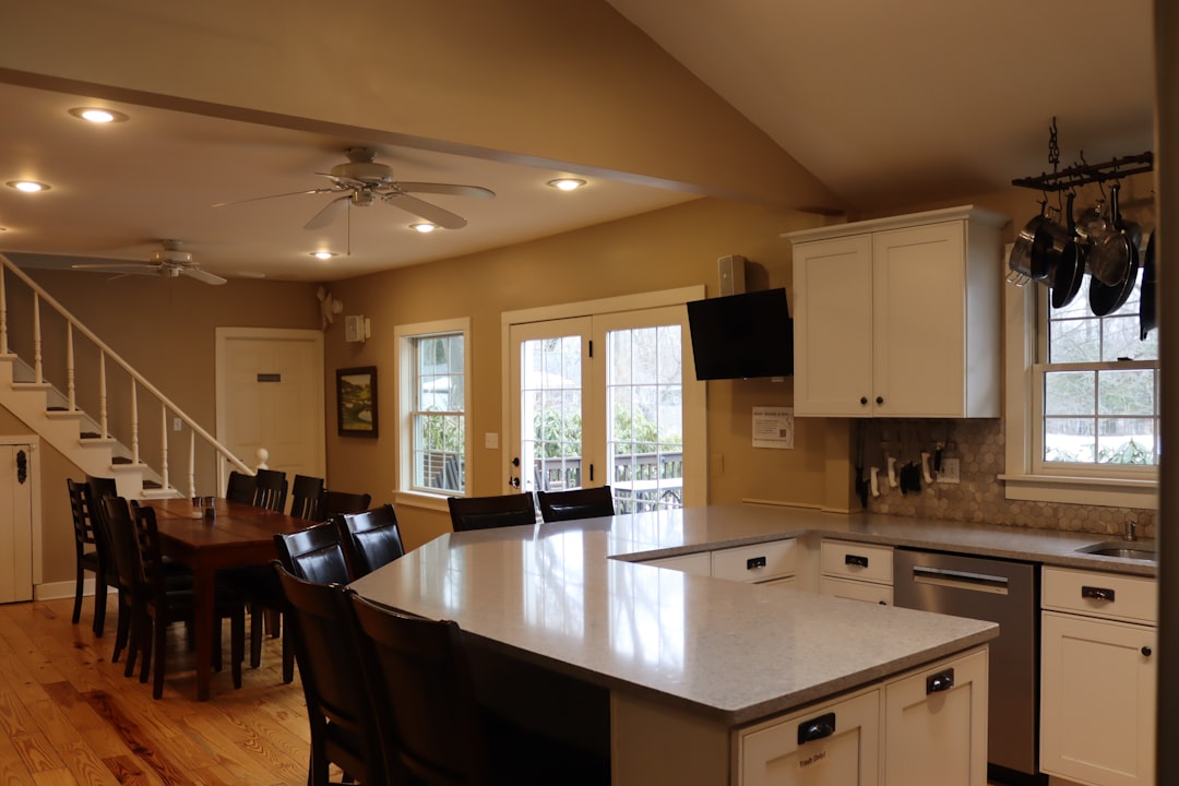 A side-by-side comparison of builder-grade vs midrange vs high-end finish selections in kitchens and bathrooms