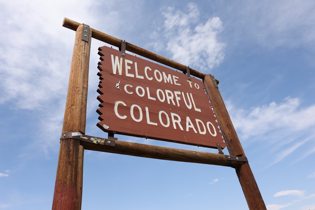 A photo of a permit plan set and inspection tags on a new Colorado home build site