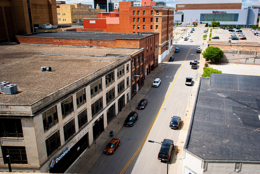 A map-style image showing Iowa metro areas with estimated construction cost ranges and key cost drivers