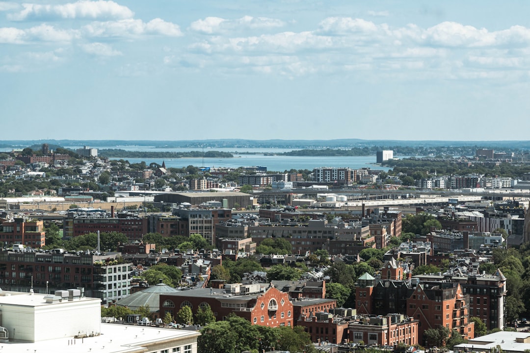 Bar chart comparing 2026 Massachusetts build cost ranges per square foot across Boston, suburban, and Western MA regions