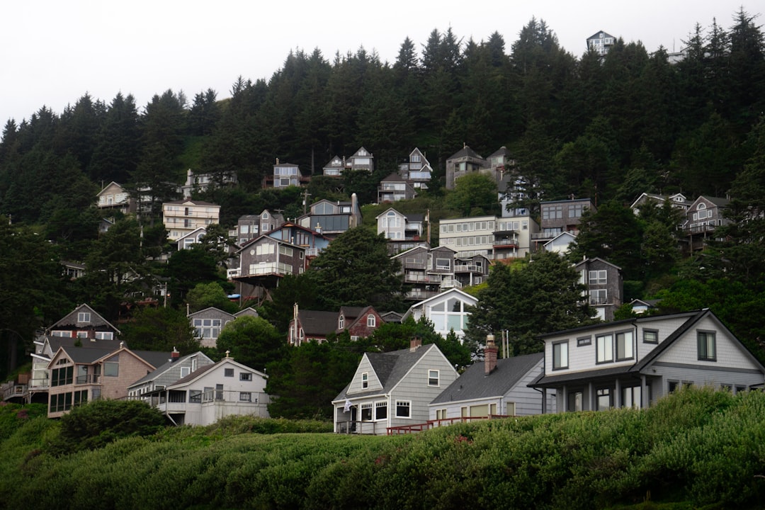 A map-style image showing Oregon regions with average cost-per-square-foot ranges by metro and rural areas