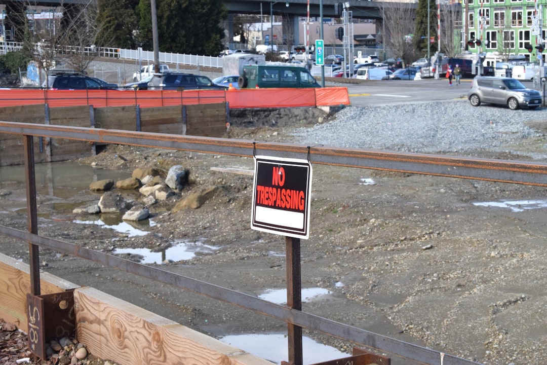 Aerial photo showing a sloped Washington building site with excavation, retaining walls, and grading equipment